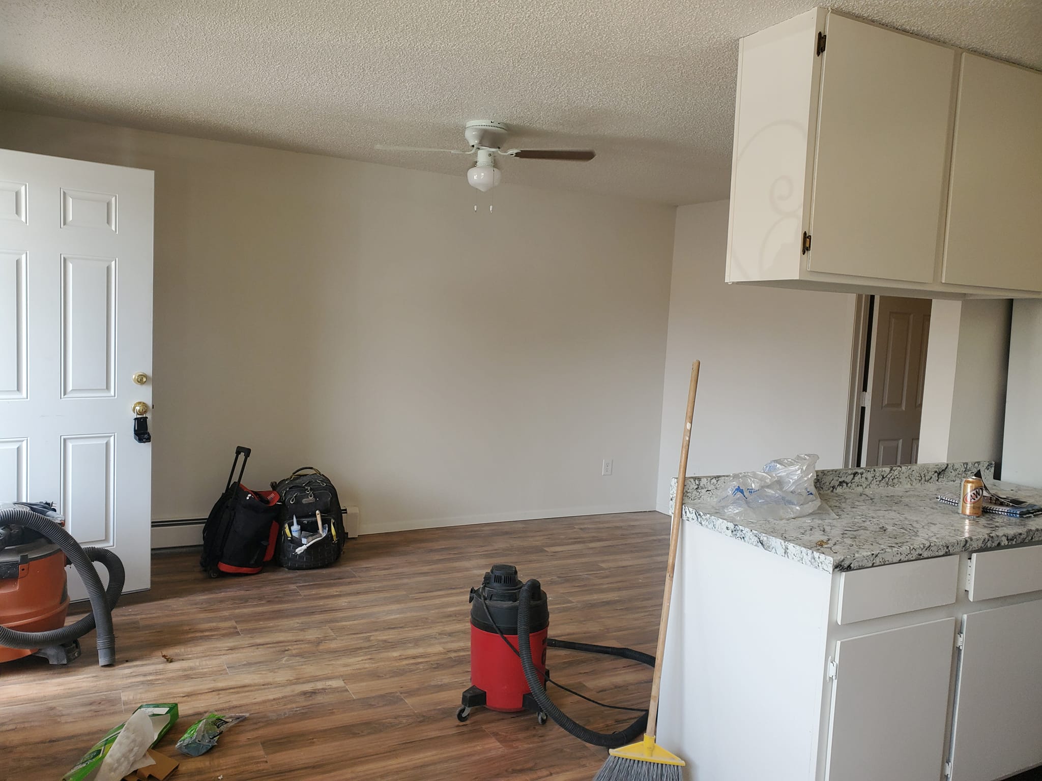 Interior renovation with cabinet installation in progress